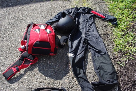 Skydiving equipment: Container/Parachute, Helmet, Kneepads, Altimeter, Log Book, Gloves and Jumpsuit.  Stuffed in a big duffel bag.
